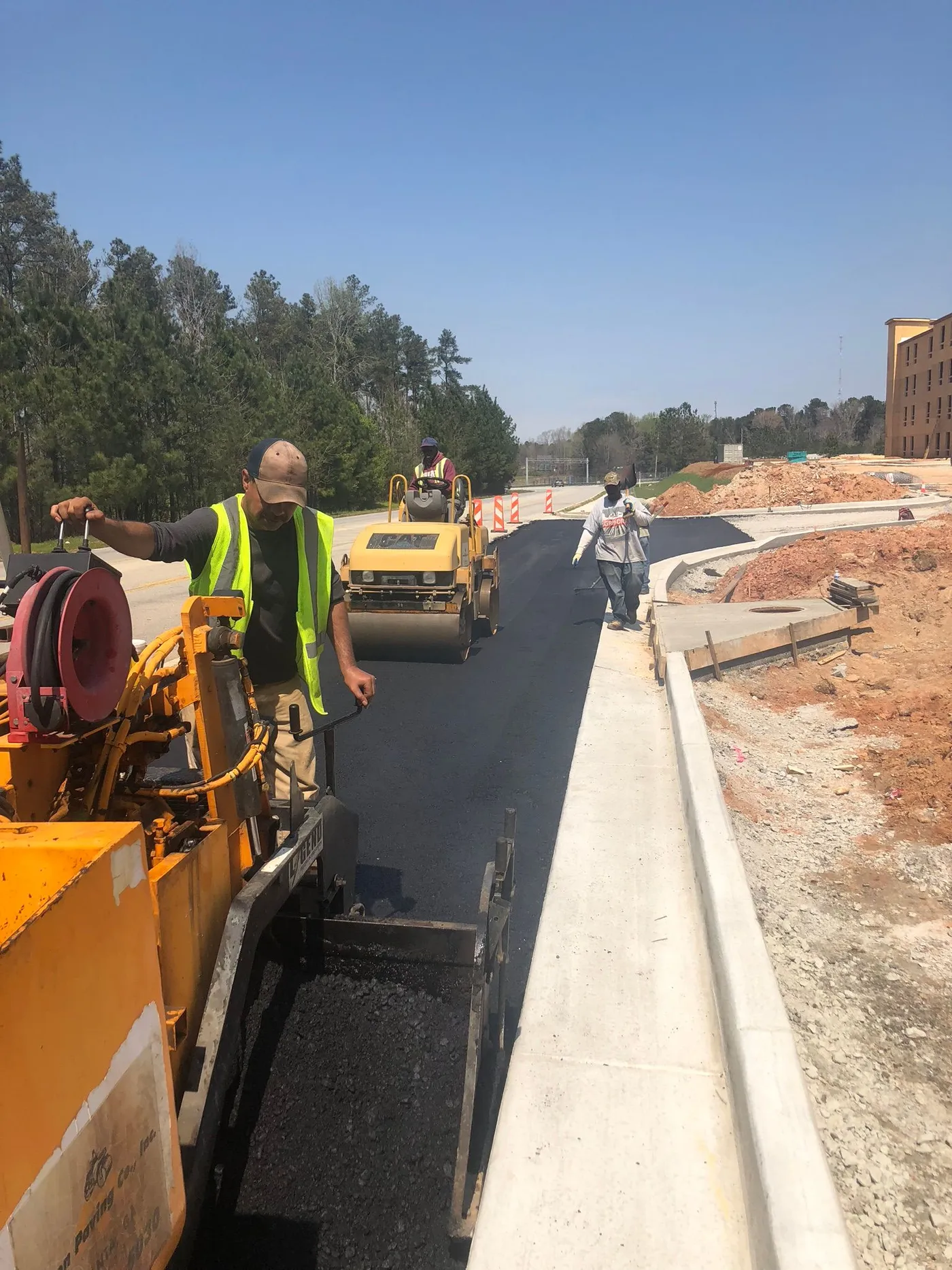 Fulton Paving crew operating asphalt equipment on a job site in Atlanta GA